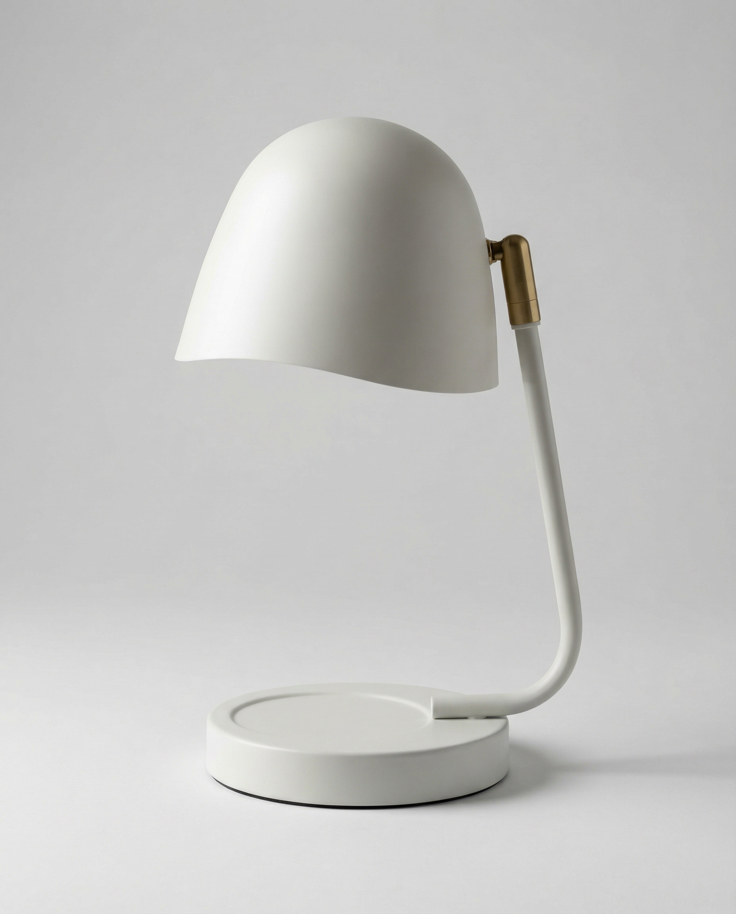 Cream candle warmer lamp with a gold handle on a white background