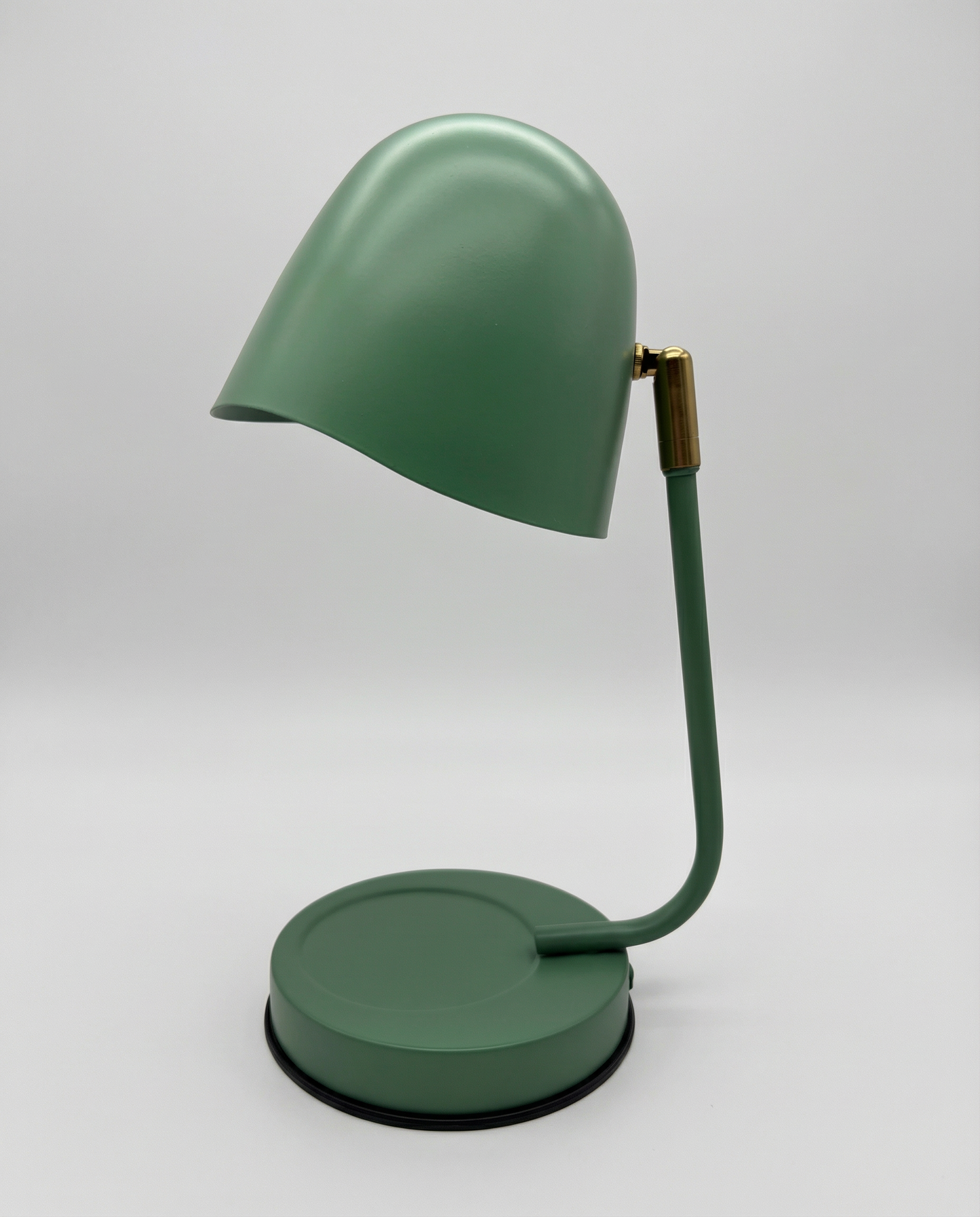 Green candle warmer lamp on a white background
