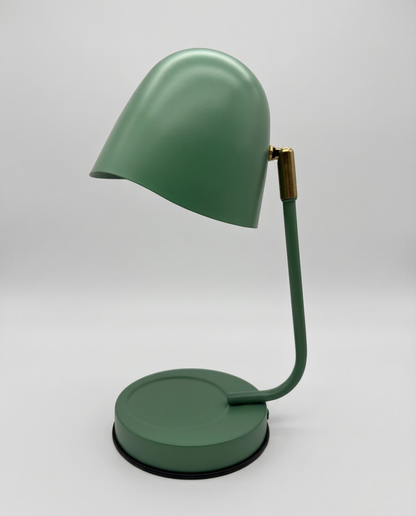 Green candle warmer lamp on a white background